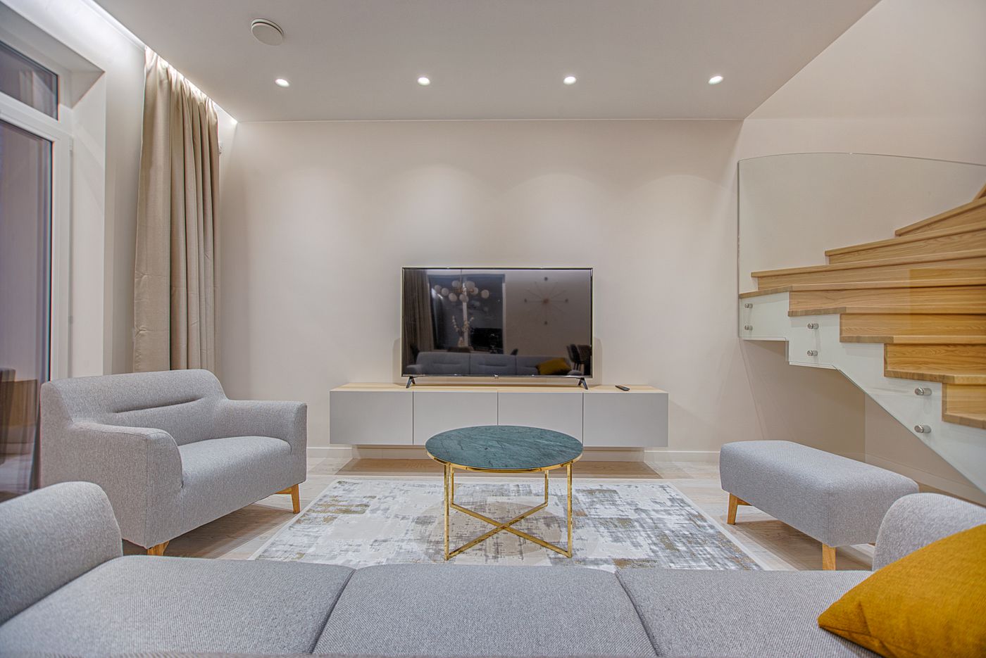 Living room connected to a staircase showing circulation between rooms